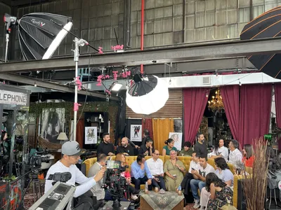 Full crew and lighting on warehouse set