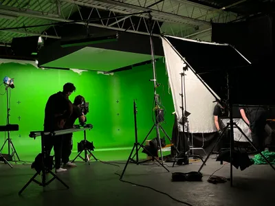 Green screen stage with full lighting setup